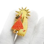 1606-4- Girl and Tree Gold Badge