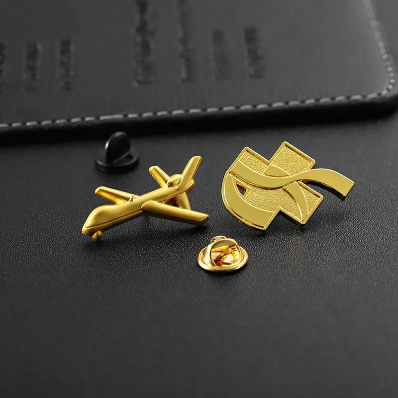 1922-5-A golden pin in the shape of an airplane