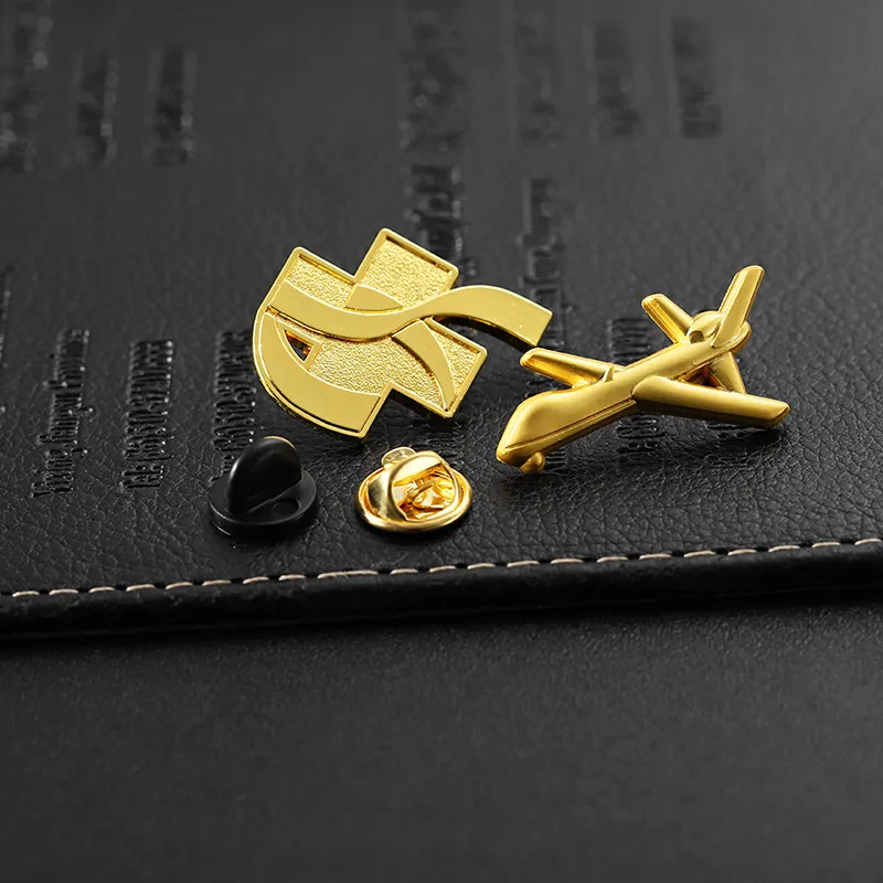 1922-8-A golden pin in the shape of an airplane